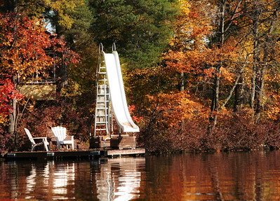 Large slide on a pier, with surrounding fall foilage